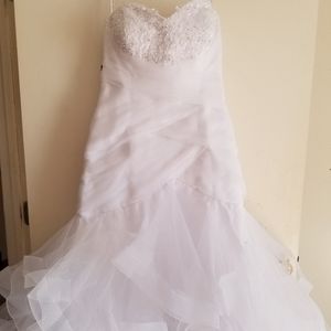 Mermaid wedding dress with ruffled skirt.